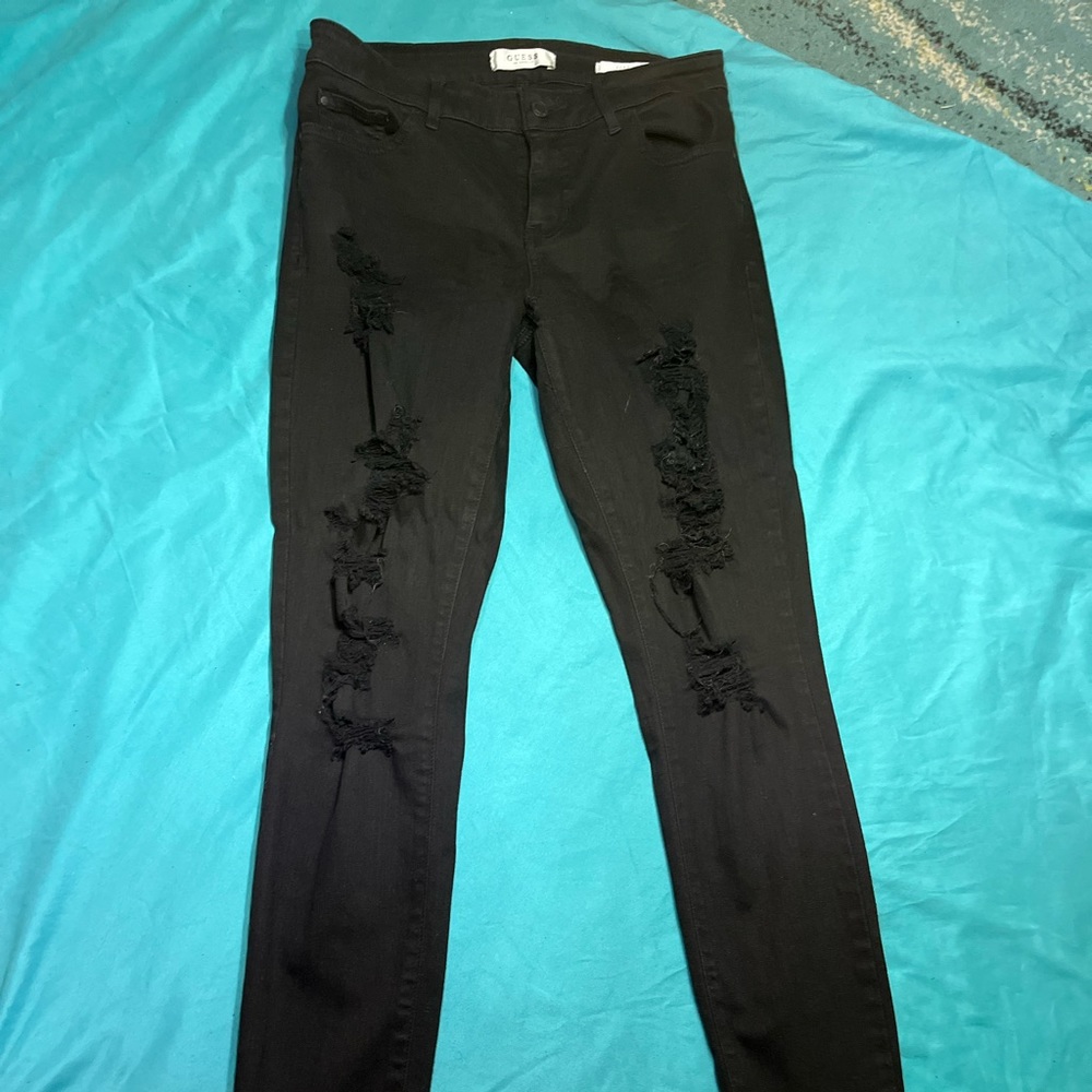 Black distressed GUESS jeans